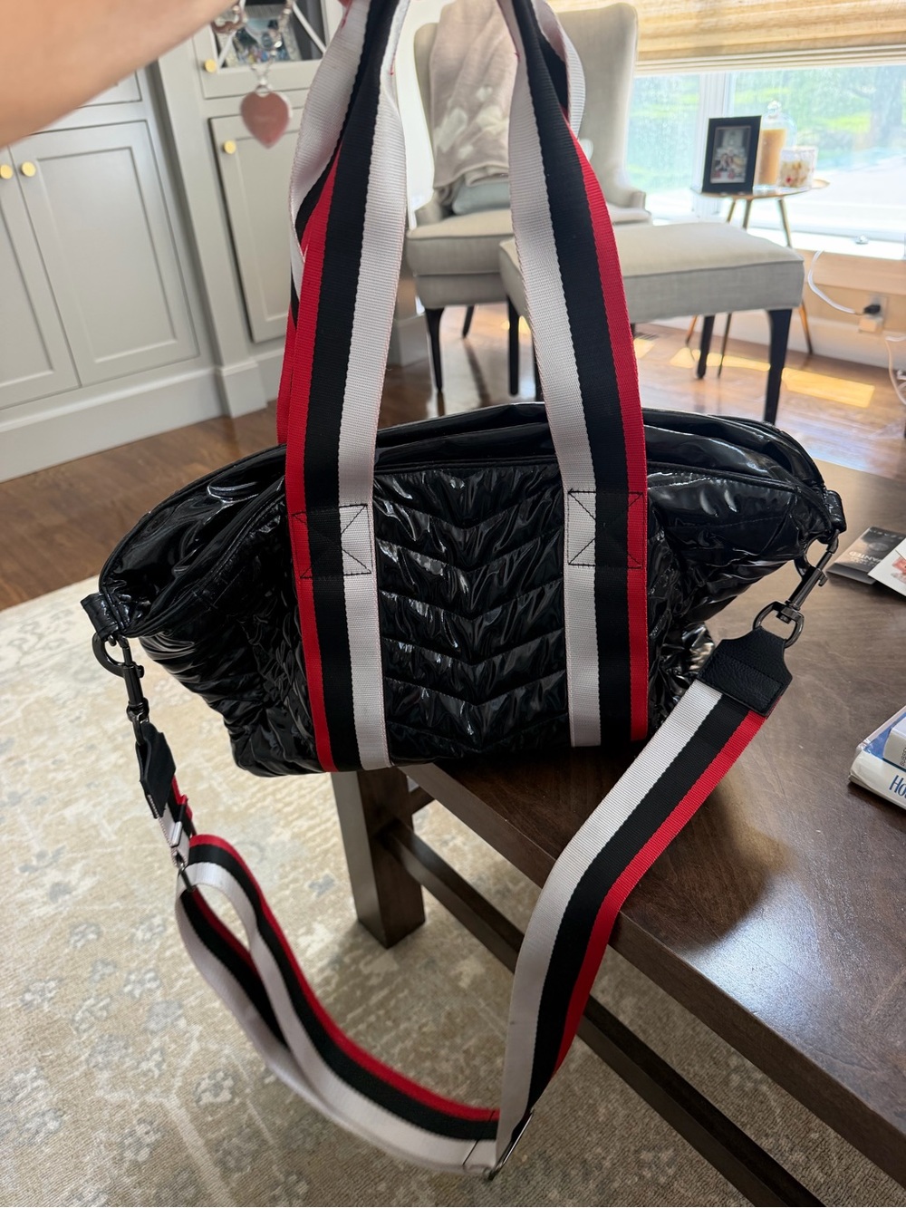 THINK ROYLN Black Quilted Duffel with Red-White-Black Striped Straps